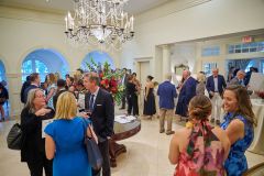 Entryway-filled-with-guests-as-they-check-in-for-the-event