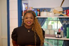 Tamieka-McLaurin-Director-of-Housing-in-front-of-the-Welcome-Home-Activation-Station